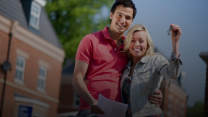 Homeowner Couples holding House Key